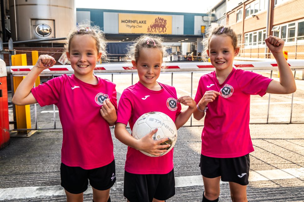 Triplets Ava, Erica and Claudia Roberts, aged eight, are looking forward to their new Mornflake-sponsored shirts